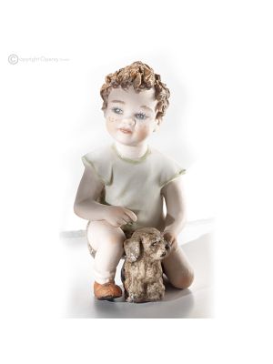 CHARLIE - Finely crafted porcelain doll, ideal for collectors.