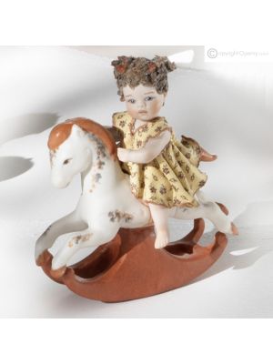 PONY MIGNON F - Timeless elegance for this handcrafted porcelain doll.